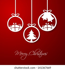 Hanging Christmas decoration on red background.