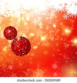 Hanging Christmas glitter baubles on bokeh lights background