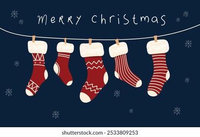 Hanging Christmas socks or stockings on rope with various cute patterns with words Merry Christmas. Christmas Holiday Socks.