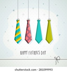 Hanging colorful neck-ties on stars decorated grey background, greeting card design for Happy Father's Day celebrations. 