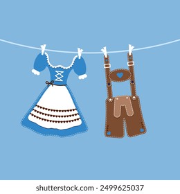 hängendes Dirndl und Lederhosen blau-brauner blauer Hintergrund