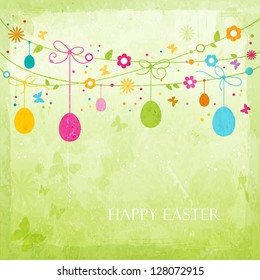 Hanging Easter eggs, flowers, butterflies and colorful dots on green textured background forming a happy, colorful border with space for your text. Great for the coming Easter celebration.