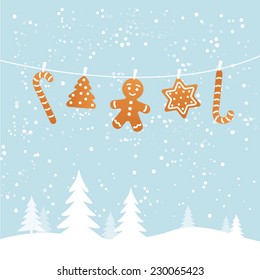 Hanging ginger breads in snowy winter scene