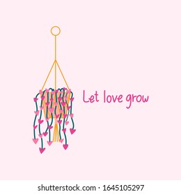 hanging heart shaped plant and 'Let love grow' text