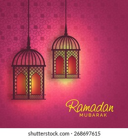 Hanging iIlluminated intricate Arabic Lamp with on abstract night background for Ramadan Kareem.