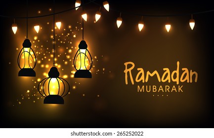 Hanging illuminate lanterns on shiny golden background for the celebration of Islamic holy month of prayers, Ramadan Mubarak. 