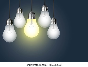 Hanging light bulb on a dark background. Idea concept.