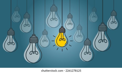 Bombillas colgadas con una resplandeciente sobre el fondo azul. Concepto de idea