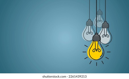 Hanging light bulbs with one glowing on blue background. Concept of idea