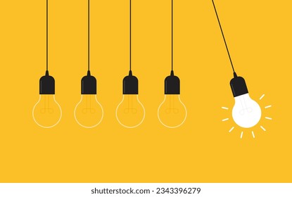 Hanging light bulbs with one glowing on yellow background. Concept of idea