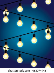 hanging on wires light bulbs on blue background