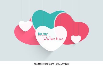 Hanging paper hearts with text Be My Valentine for Happy Valentines Day celebration.