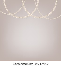 Hanging pearl necklaces jewelry on gray background