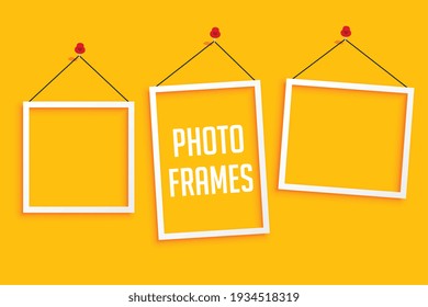 hanging photo frames on yellow background