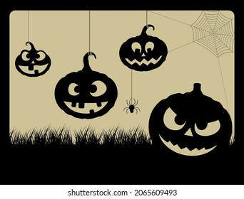 HANGING PUMPKINS SMILING AND A SPIDER WEB IN THE BACKGROUND