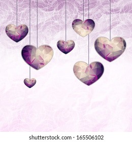 Hanging small violet hearts with triangle pattern and lace-like outline on graphic background