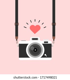 hanging vintage camera with  heart pink background