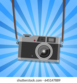 Hanging vintage camera - retro blue background. Vector.