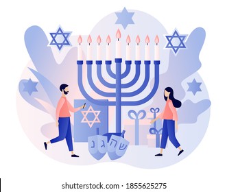 Hanukkah concept. Traditional jewish holiday with tiny people and symbols - menorah candles, dreidels spinning top, star David. Modern flat cartoon style. Vector illustration on white background