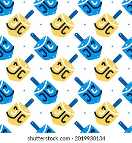 Hanukkah seamless pattern with dreidels. Jewish holiday texture, background. 