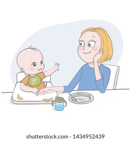 Happiness concept. Loving young mother feeding her baby in a high chair as it reaches out for her after messing the food all over the pace in a family and motherhood concept