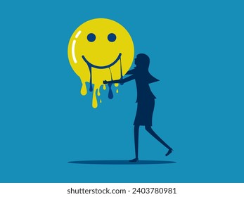 Happiness disappears. woman holds a melting smiley face icon