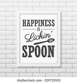 Happiness is lickin the spoon - Quote typographical Background in realistic square white frame on the brick wall background. Vector EPS10 illustration. 