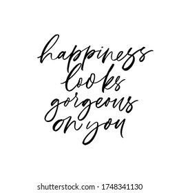 Happiness looks gorgeous on you vector lettering. Hand drawn modern brush calligraphy isolated on white background 