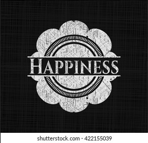 Happiness written on a chalkboard