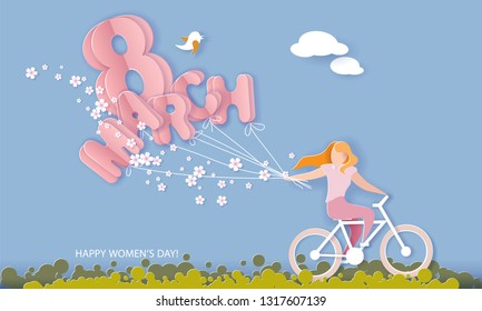 Happy 8 March womens day card. Woman riding bicycle with flowers and air balloons shaped as letters on blue sky background. Vector paper cut illustration