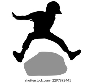 Happy and active young boy jumping over the stone outdoor