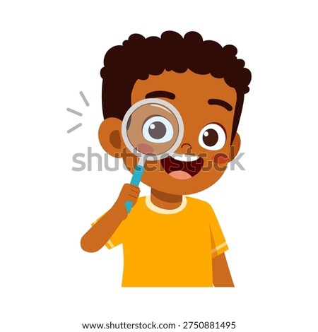 Happy African American boy exploring with a magnifying glass showing curiosity and a joyful smile