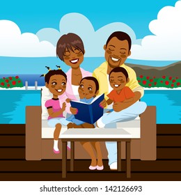 Happy African American Family Reading A Book Or Looking A Photo Album Sitting On Outdoor Sofa At The Pool Side