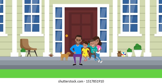 Happy African American Family Siiting On Porch Of Their House