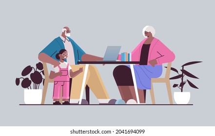 happy african american grandparents with granddaughter using laptop social media network online communication