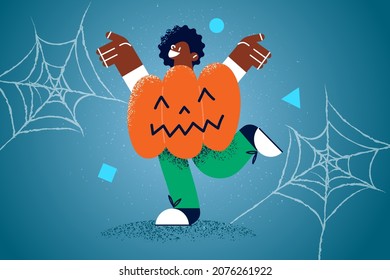 Happy African American in pumpkin costume celebrate Halloween party. Smiling ethnic kid have fun enjoy All Saints Eve celebration, spider web around. Scary autumn holiday. Vector illustration. 