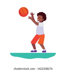 happy afro little boy playing basketball