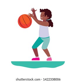 happy afro little girl playing basketball