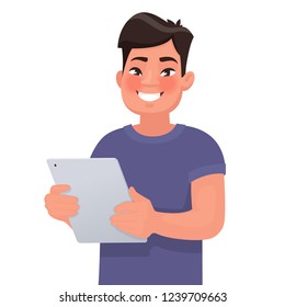 Happy Asian man holding a tablet in his hands. People and gadgets. Vector illustration in cartoon style