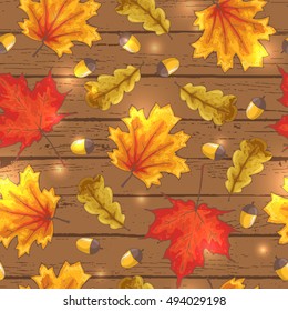 Happy autumn vector seamless pattern with yellow, green, red, maple and oak leaves, acorns on wooden background; Fall print for notebook cover, banners; hand drawn cozy illustration in sketch style