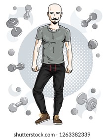 Happy bald young adult man with beard and mustaches standing on simple background with dumbbells and barbells. Vector character, sport and fitness theme.