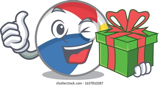 Happy beach ball character having a gift box