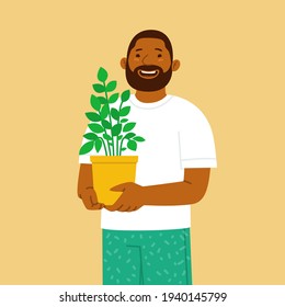 Happy bearded man holding a pot with a houseplant in his hands. Hobby to grow plants and flowers. Vector illustration in flat style