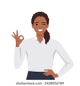 Happy beautiful young woman giving well done ok sign with winking eye and positive feedback approval standing with hand on the waist looking confident. Flat vector