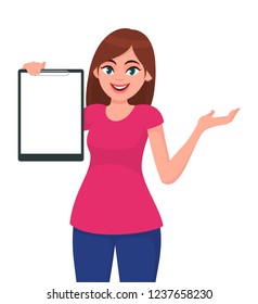 Happy beautiful young woman 
holding / showing a blank clipboard and showing hand to copy space side away, while standing against white background. Concept illustration in vector cartoon style.