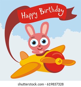 Happy Birthday! Funny rabbit flies on airplane with greeting on red ribbon.