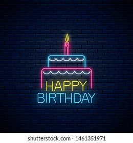 Happy birthday glowing neon sign with cake and a candle on dark brick wall background. Birthday cake celebration symbol in neon style. Vector illustration.