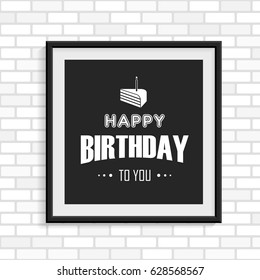 Happy Birthday greeting card in the black photo frame on white brick wall