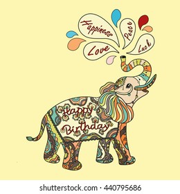 Happy Birthday. Greeting card with wishes and fantasy patterned elephant. Ethnic tribal styled pattern. Colored zentangle animal. Boho design. Vector.