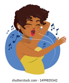 Happy black teenager woman listening to music with earphones and dancing